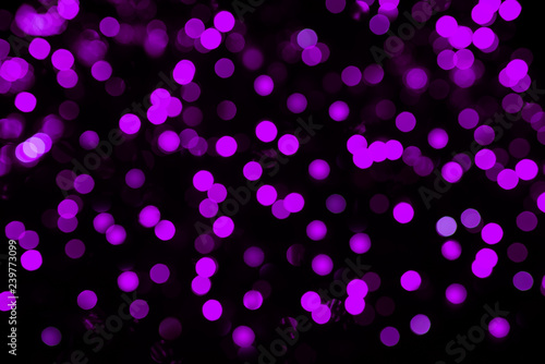 Color abstract bokeh on dark background.