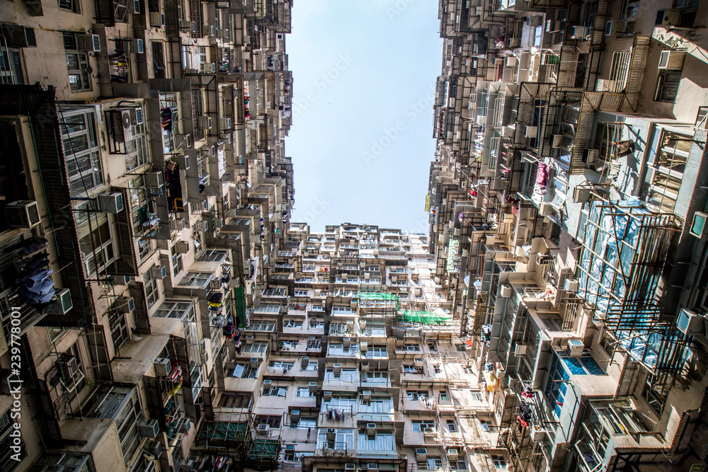 Famous building name Yick Fat Yick residentrial building at Cheong Fok Cheong in Quarry Bay, Hong Kong with urban housing apartment background.