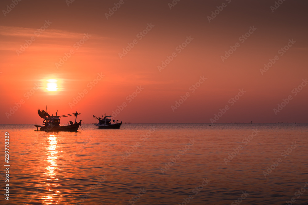 Sunset time with fishing boat 