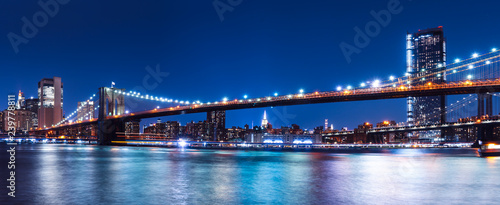 Brooklyn bridge with New York City view to Manhattan skyline at night
