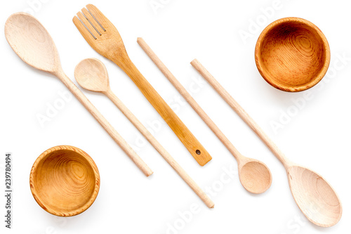 Village table with wooden cutlery set white background top view