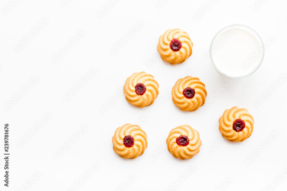 Drink milk with cookies concept. Cup of milk and fresh homemade cookies on white background top view copy space