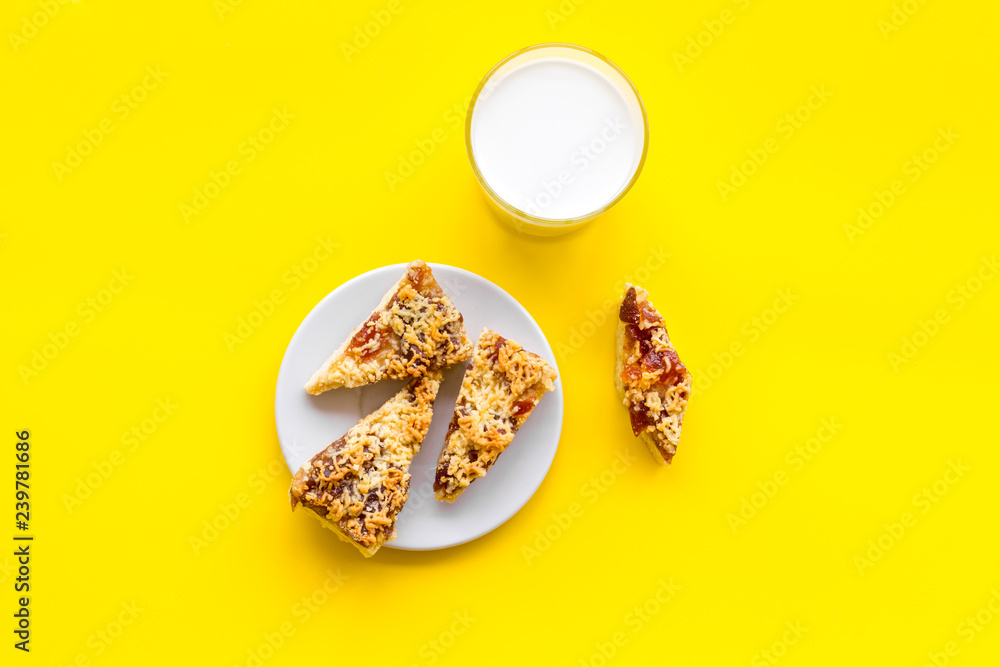 Drink milk with cookies concept. Cup of milk and fresh homemade cookies on yellow background top view space for text Drink milk with cookies concept. Cup of milk and fresh homemade cookies on yellow background top view space for text