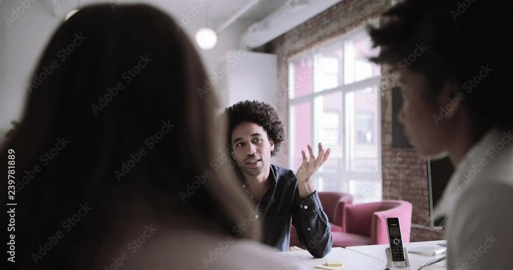 Business colleagues having a brainstorming meeting in an office Business colleagues having a brainstorming meeting in an office