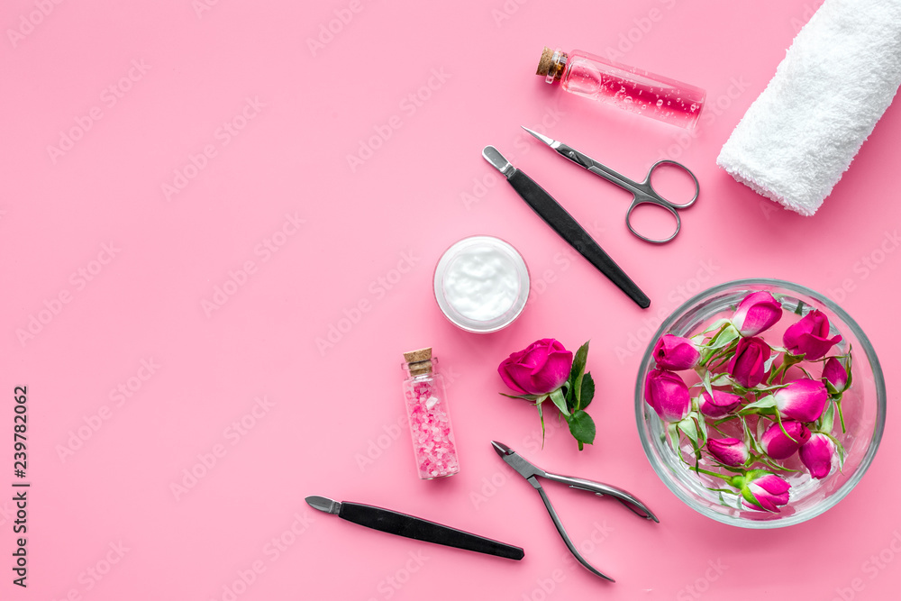 Naklejka premium manicure tools set for nail care on rose background top view mock up