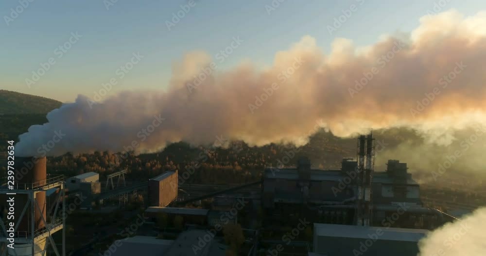 Clouds of smoke coming from the chimneys. industrial pipes. Environmental pollution. Aerial 4k Clouds of smoke coming from the chimneys. industrial pipes. Environmental pollution. Aerial 4k
