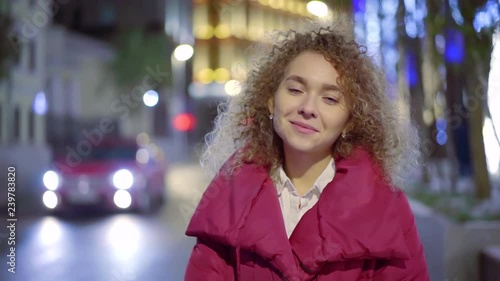 Wallpaper Mural Attractive smiling girl in pink jacket standing outdoor by the road. Torontodigital.ca