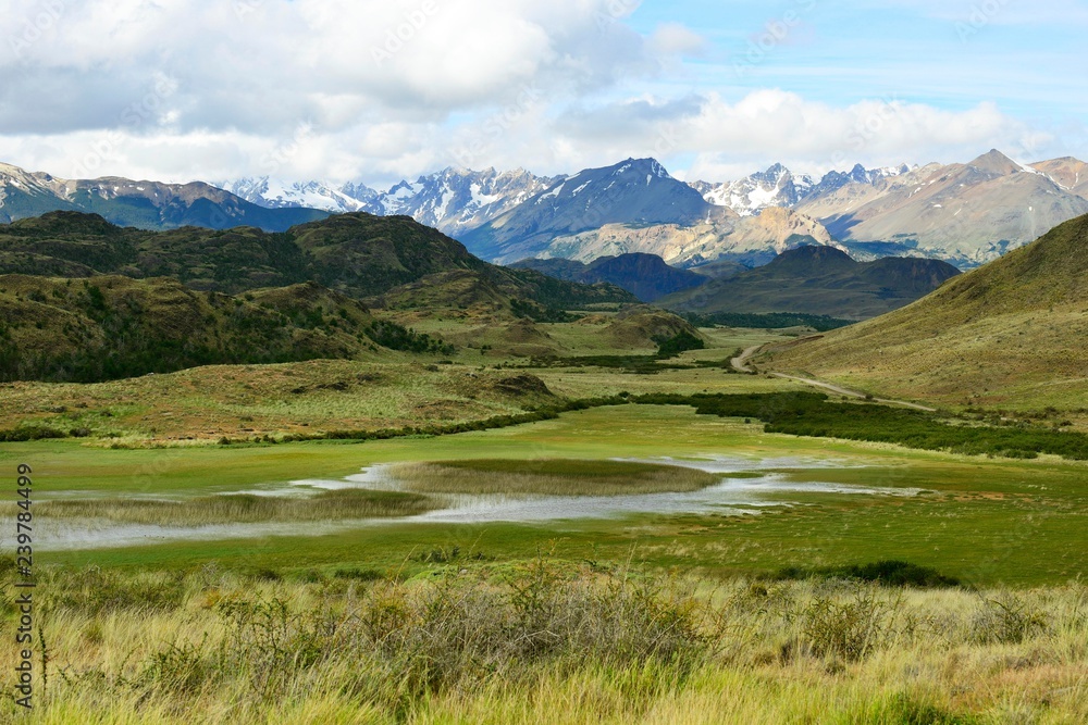 Meandering brook in front of mountain landscape, Valle Chacabuco, near Cochrane, Region de Aysen, Chile, South America Meandering brook in front of mountain landscape, Valle Chacabuco, near Cochrane, Region de Aysen, Chile, South America