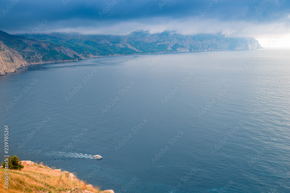 Landscape marine, a small boat goes to sea, weather before a storm Landscape marine, a small boat goes to sea, weather before a storm