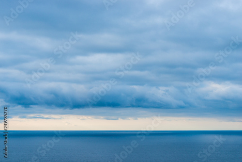Landscape of the sea, view of the horizon, heavy rain clouds over the water © kosmos111