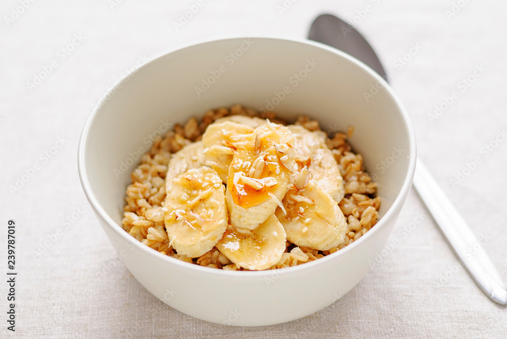 Bowl of oatmeal with sweet banana Bowl of oatmeal with sweet banana