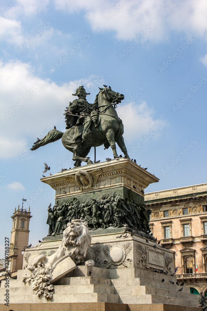 Vittorio Emanuele statue monument with lion in the center of Milan, Italy