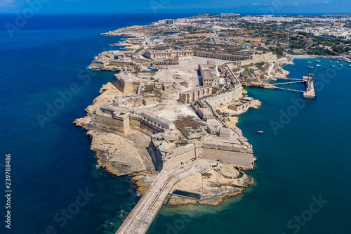 Fort Ricasoli aerial view. Island of Malta from above. Bastioned fort built by the Order of Saint John in Kalkara, Malta. Gallows' Point, north shore of Rinella Bay, entrance to the Grand Harbour.