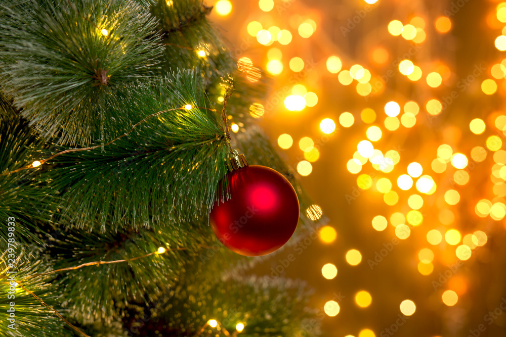 Christmas tree on the background of blurry lights of Christmas garland. Christmas concept. Christmas tree on the background of blurry lights of Christmas garland. Christmas concept.