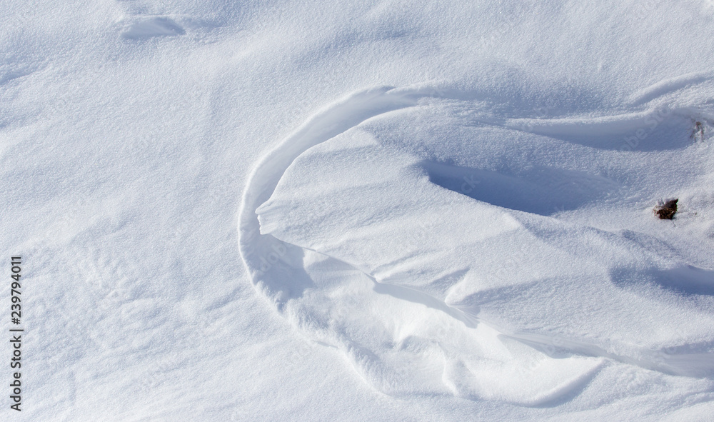White snow on the mountainside as a background White snow on the mountainside as a background