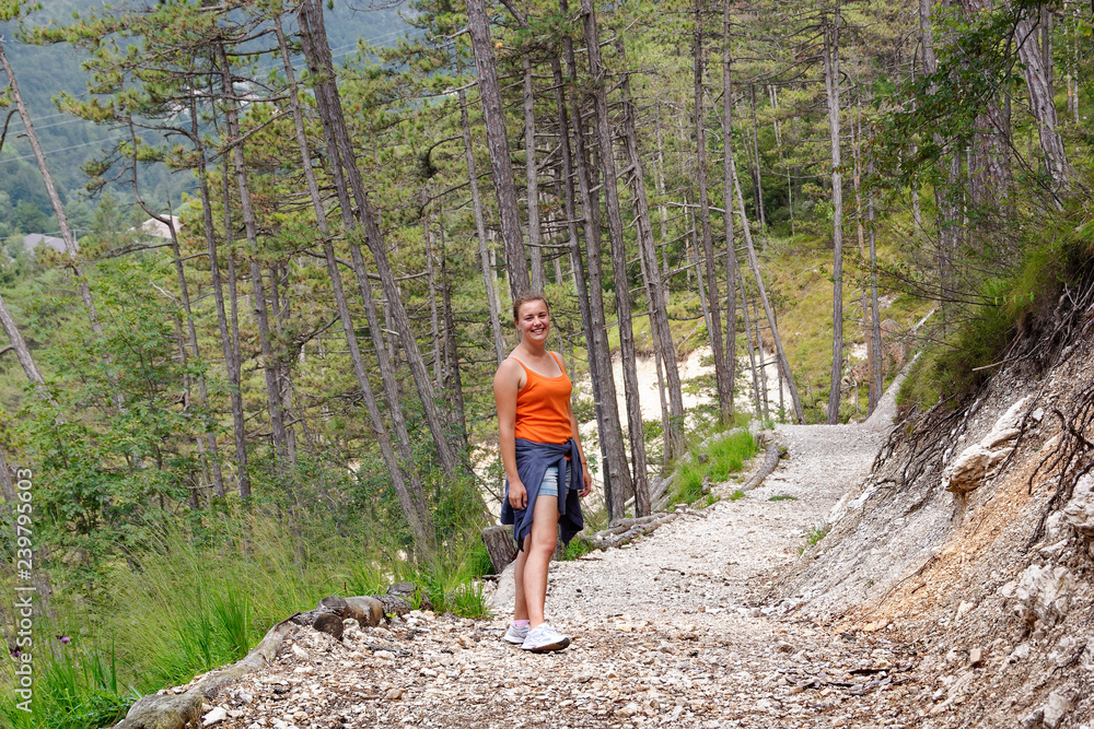 girl traveling in the mountains on foot