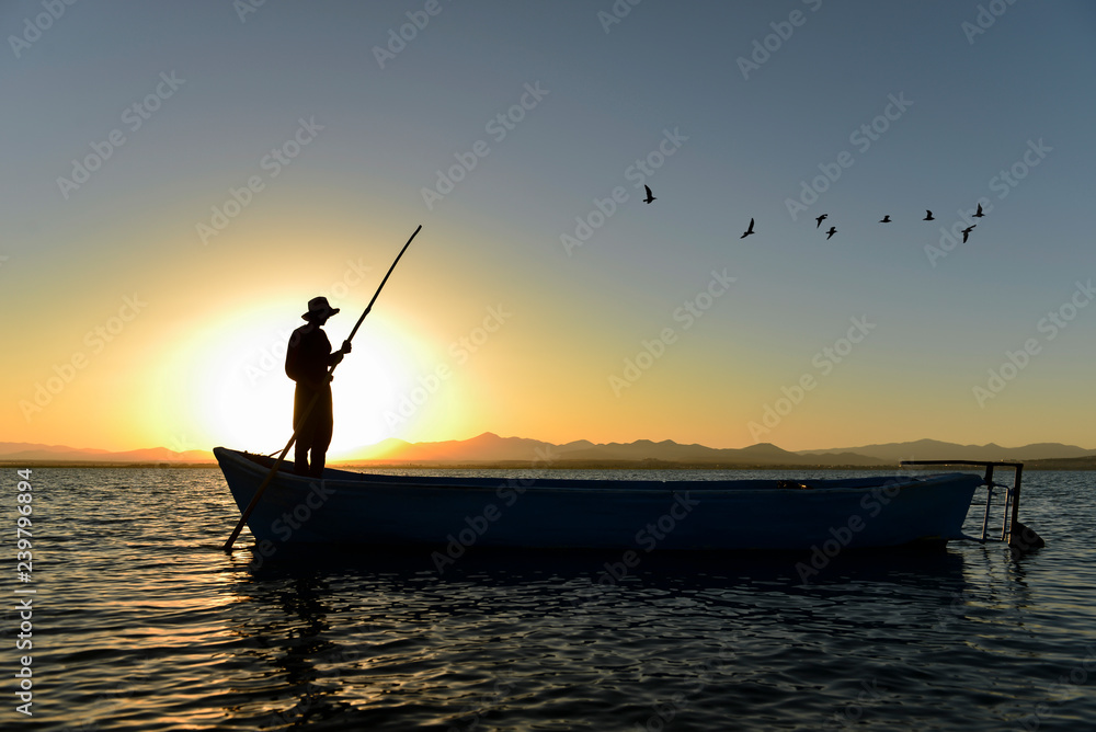 Fototapeta premium working hours for the fisherman, sunrise and a peaceful day