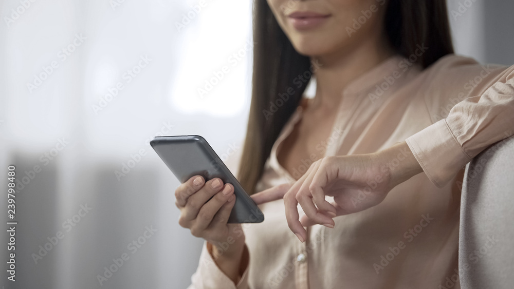 Beautiful woman booking hotel room with a smartphone, user-friendly reserving Beautiful woman booking hotel room with a smartphone, user-friendly reserving