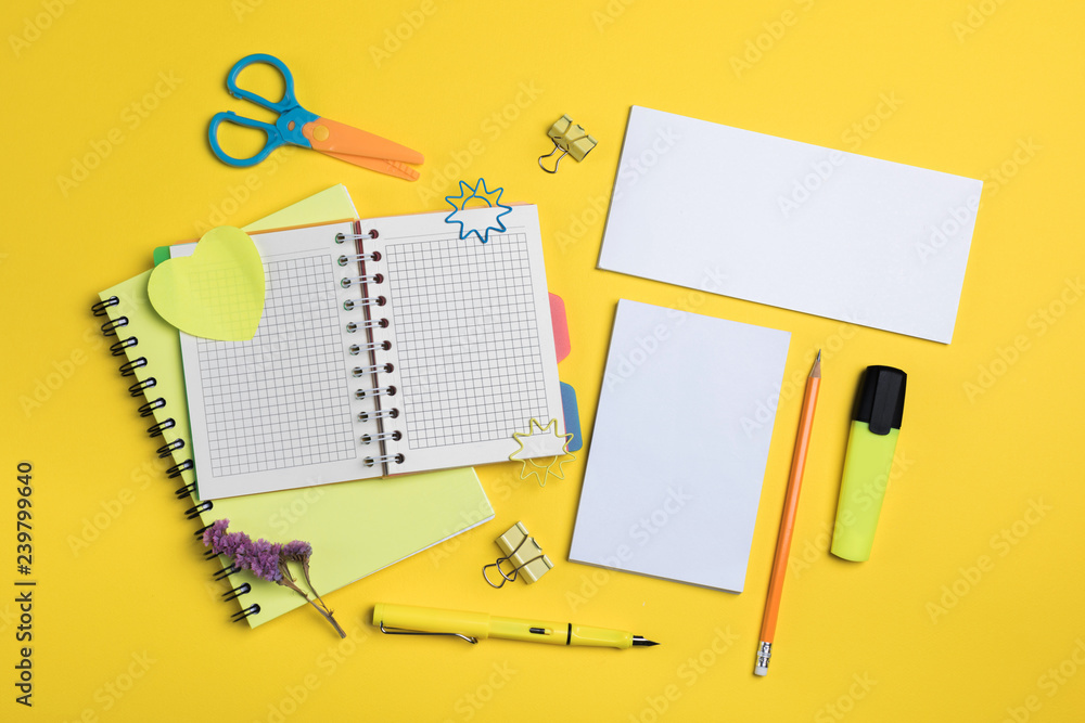 Flat lay composition with stationery on yellow background. Mock up for design Flat lay composition with stationery on yellow background. Mock up for design
