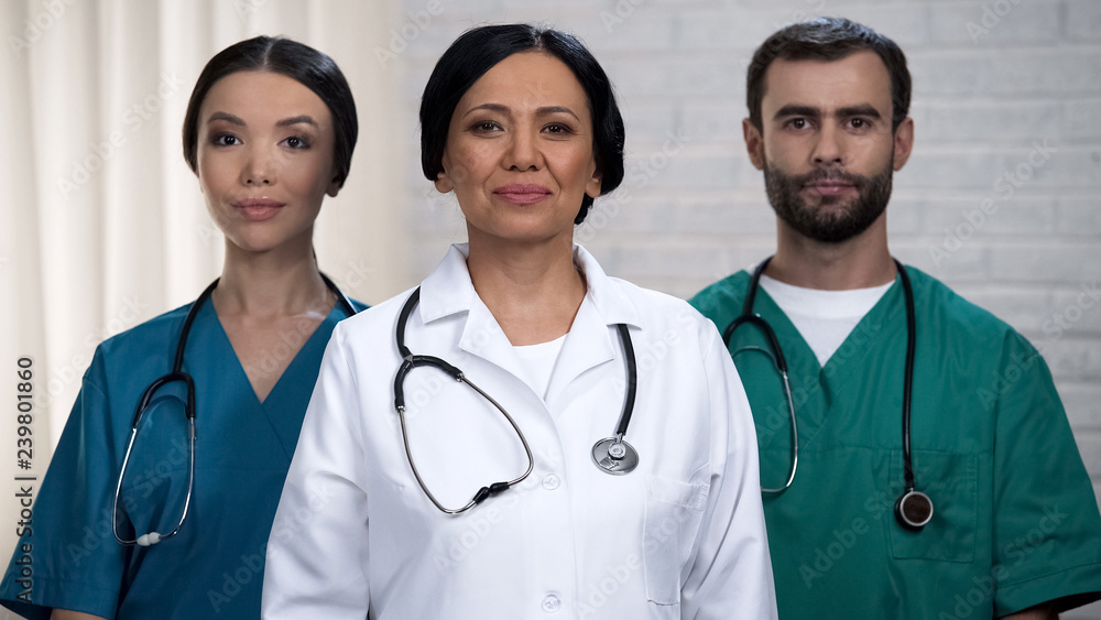 Professional surgeon team ready for operation, patient treatment in safe hands Professional surgeon team ready for operation, patient treatment in safe hands