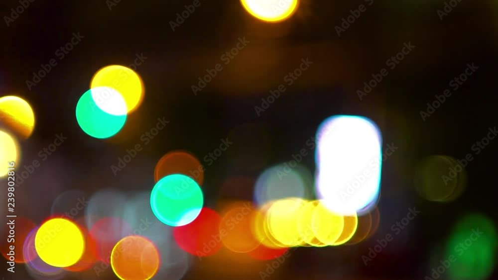 Round bokeh and multicolored highlights. Night city in defocus. Round bokeh and multicolored highlights. Night city in defocus.