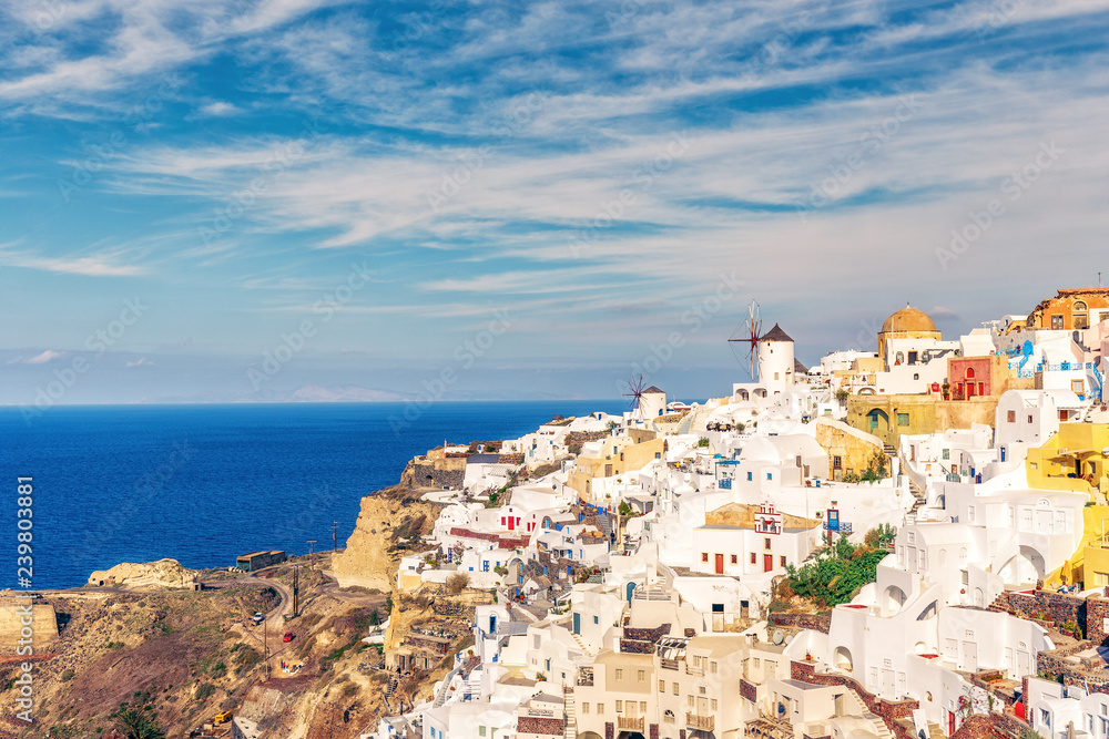 Architecture of Oia village, Santorini island in Greece, on a summer day. Scenic travel background.