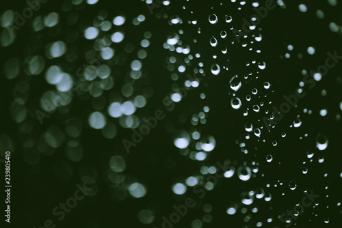 Wallpaper Mural Dirty window glass with drops of rain. Atmospheric green background with raindrops in bokeh. Droplets and stains close up. Detailed transparent texture in macro with copy space. Rainy weather. Torontodigital.ca