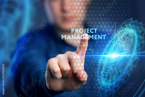 The concept of business, technology, the Internet and the network. A young entrepreneur working on a virtual screen of the future and sees the inscription: Project management