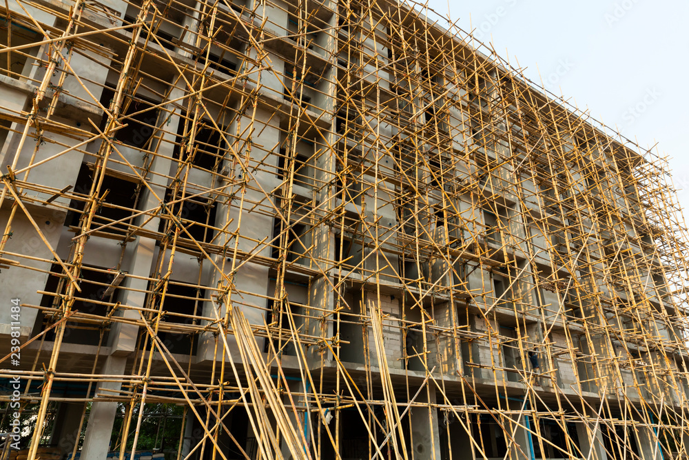 Construction scaffold made from bamboo tree covered the new building