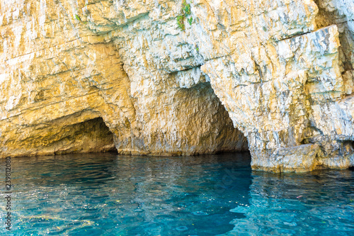 Greece, Zakynthos, Keri caves with perfect blue water and white chalk rock