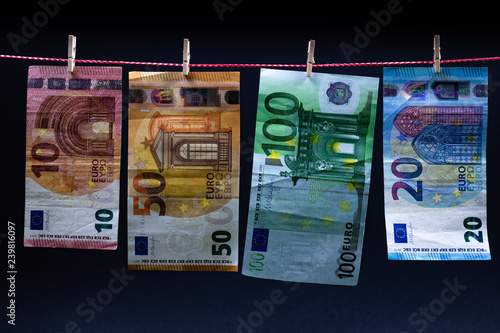 euro bills on a rope with clothespins