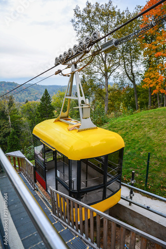 Wallpaper Mural Sigulda cable car for traveling through the Gauja valley, Latvia. Panoramic view of leaf fall forest. Autumn landscape on cool, cloudy day. Torontodigital.ca