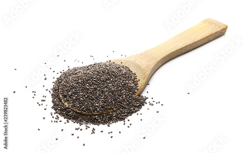 Chia seed pile with wooden spoon isolated on white background