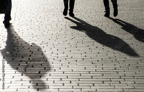 Shadows of Peoples walking on street