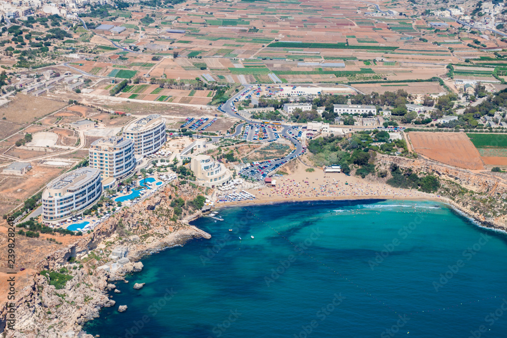 Aerial view of Golden bay beach, Ghajn Tuffieha bay. Mellieha (Il-Mellieħa), Northern Region, Malta island. Malta from above.