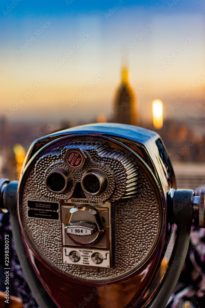New York city view of binoculars with blurred background of Downtown