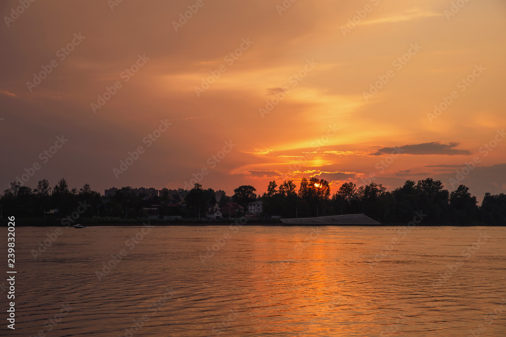 colorful sunset on the river Neva with a beautiful sunny path on the water