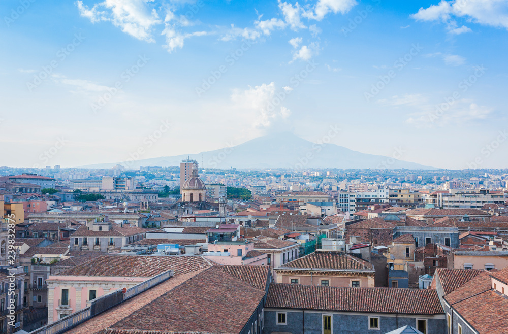 Catania rooftops and cityscape with Mount Etna, active volcano in the background, Sicily, Italy