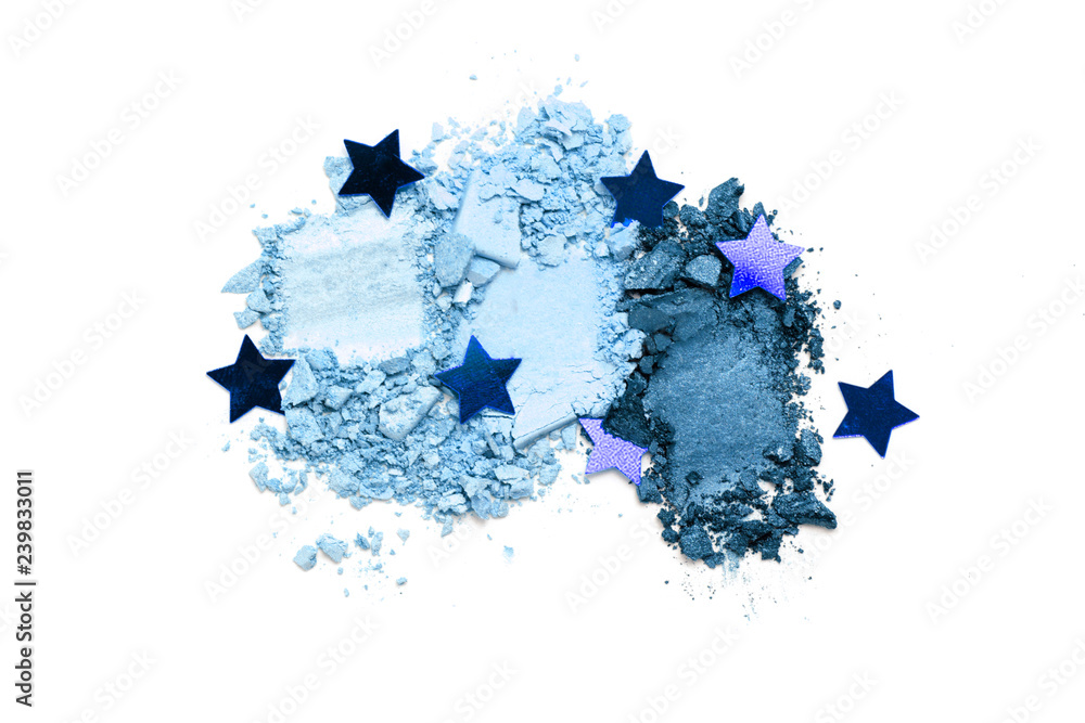 A broken blue gradient colored eye shadows isolated on a white background. Top view, flat lay. Copy space for your text A broken blue gradient colored eye shadows isolated on a white background. Top view, flat lay. Copy space for your text