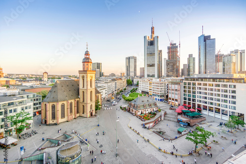 Lutheran church and modern downtown with skyscrapers in Frankfurt upon Main, Germany photo