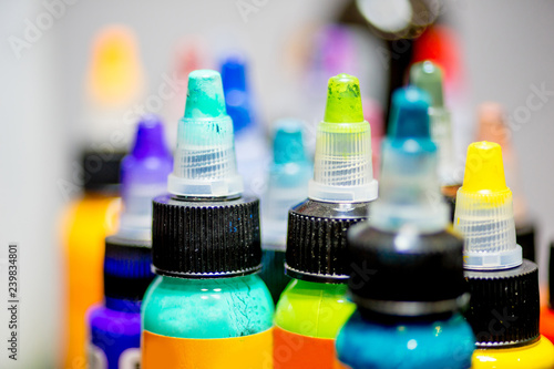 tattoo equipment machine and colorful ink in a workshop