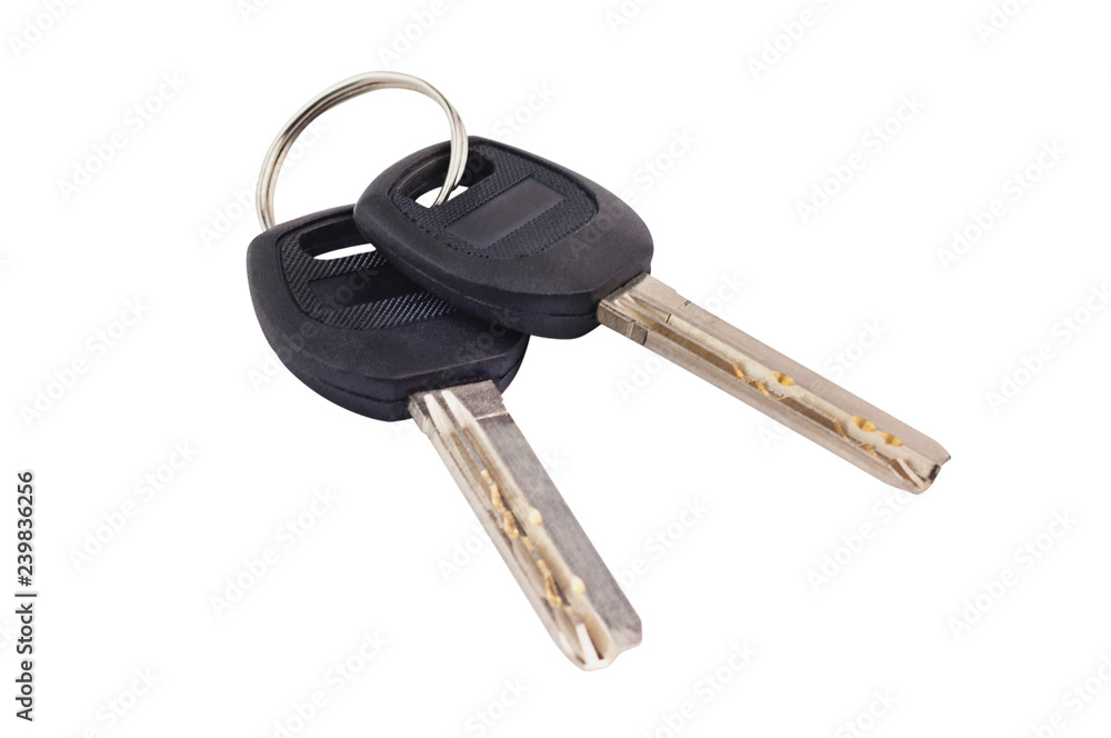 Pair of metal shiny keys with black plastic or rubber handle attached of keyring for door or car isolated on white background Pair of metal shiny keys with black plastic or rubber handle attached of keyring for door or car isolated on white background
