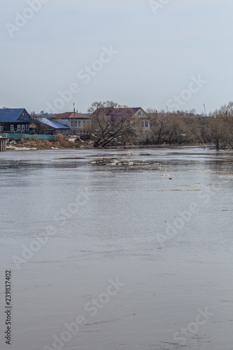 spring spill in the small Russian village of Kholui photo