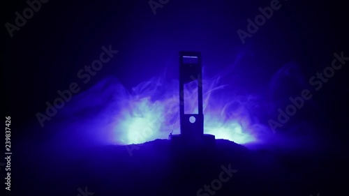 Horror view of Guillotine. Human at guillotine on a dark foggy background. Execution concept photo