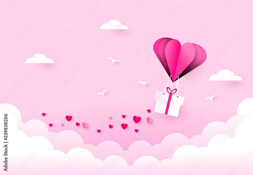 Love and valentine day. Heart air balloon carries gift box