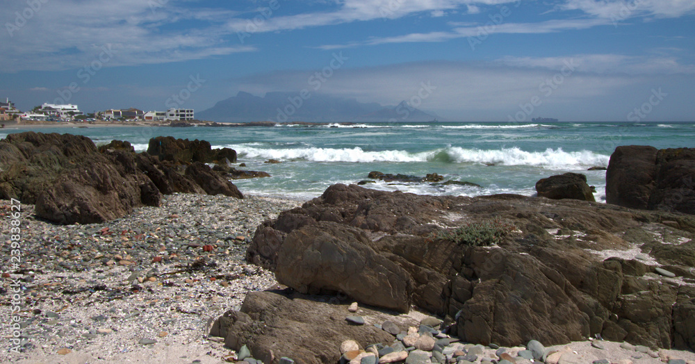 Table Mountain with rocks on beach