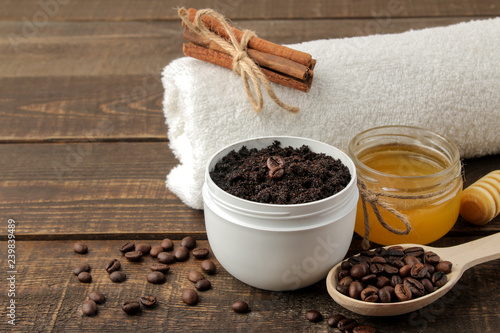 homemade coffee scrub in a white jar for the face and body and various ingredients for making scrub. spa. cosmetics. care cosmetics photo