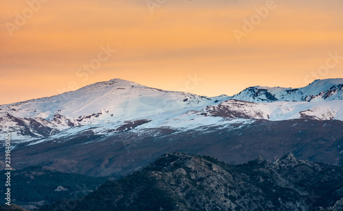 Beautiful image of Sierra Nevada sky stations and snowcapped mountains around during sunset, Granada