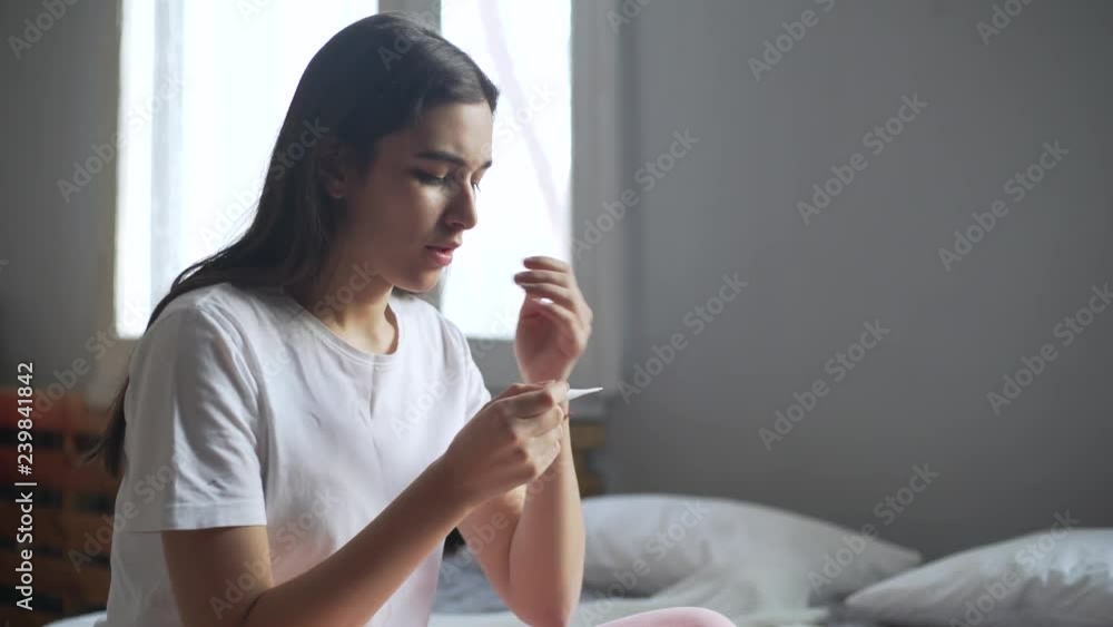 sad woman looking on pregnancy test unexpected cries sad woman looking on pregnancy test unexpected cries