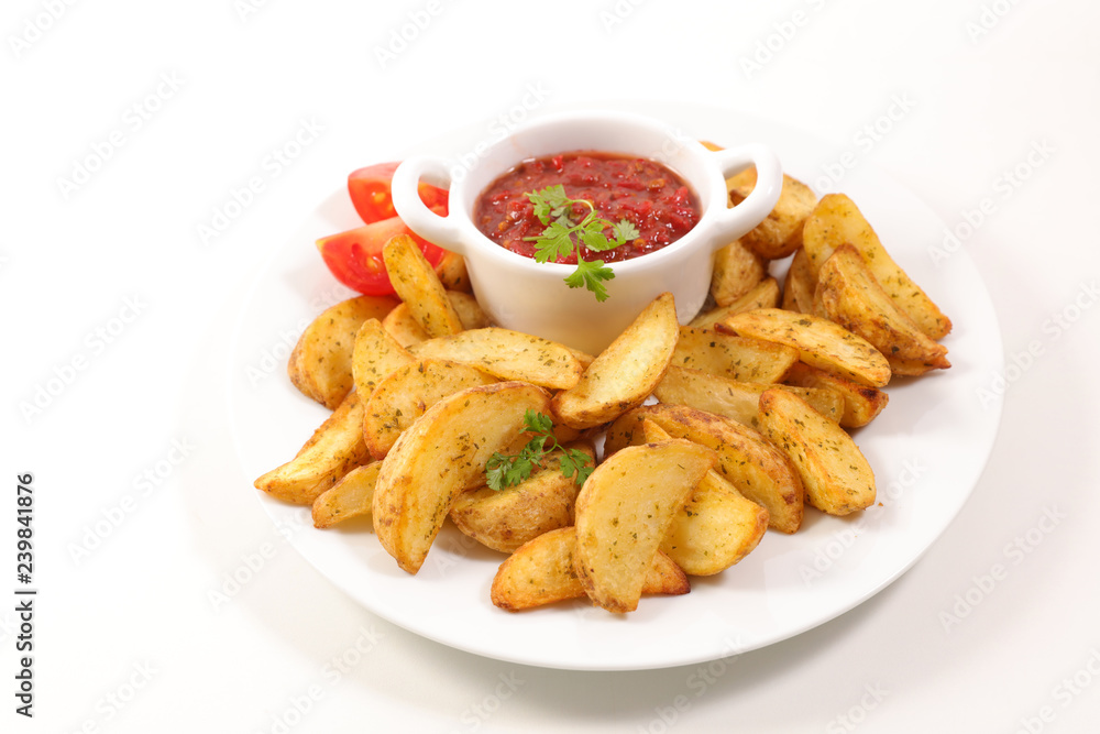 french fries and tomato sauce on white background french fries and tomato sauce on white background